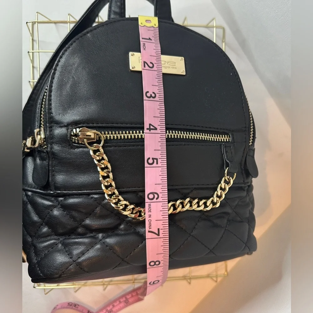 BEBE Black Faux Leather Quilted Mini Backpack Purse with Gold Chain Accent